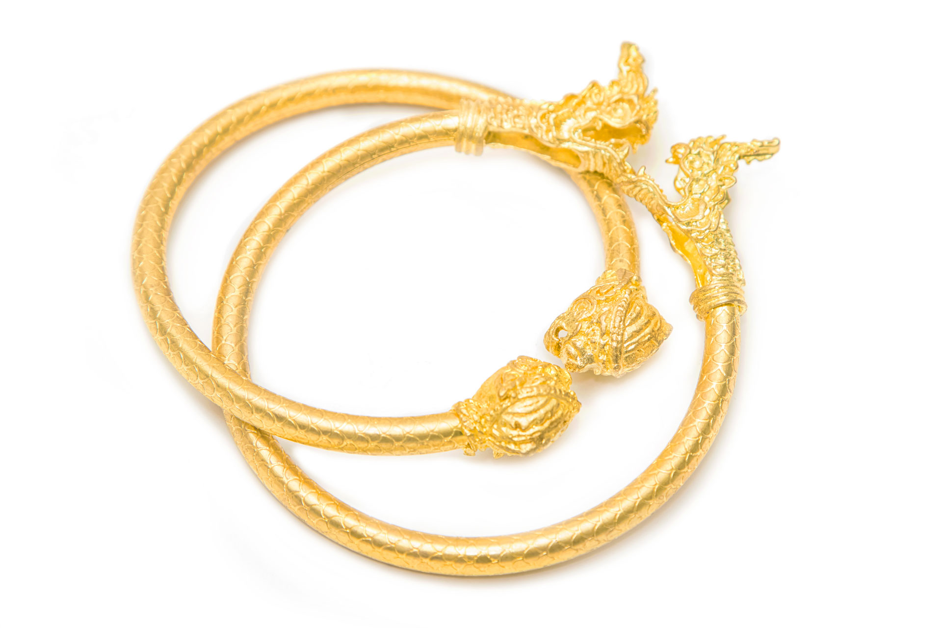 Gold bracelets intertwined