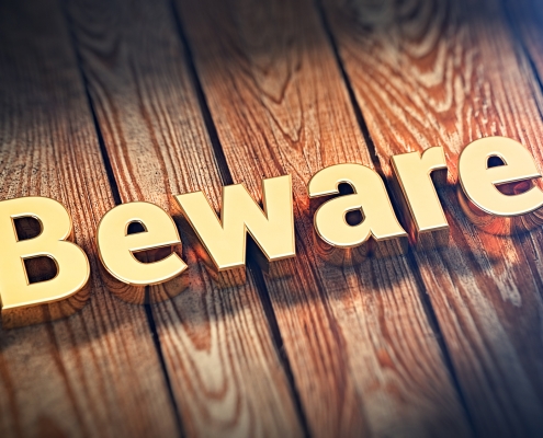 The word "Beware" is lined with gold letters on wooden planks. 3D illustration image