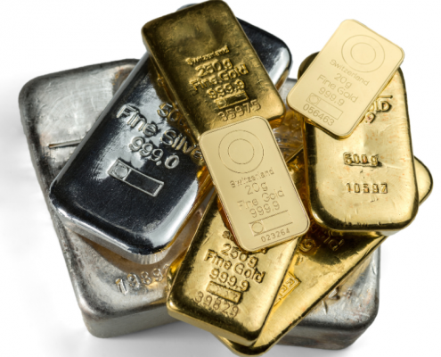 How to Get Started with Investing in Precious Metals - pile of gold and silver bars