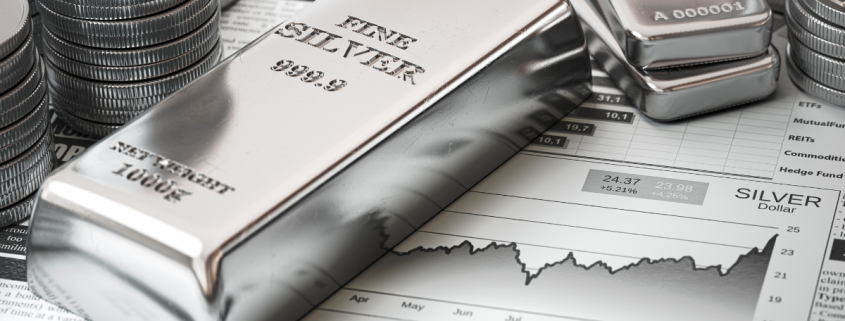 What is a Silver Exchange? silver bars and coins on top of a financial report showing growth of silver prices