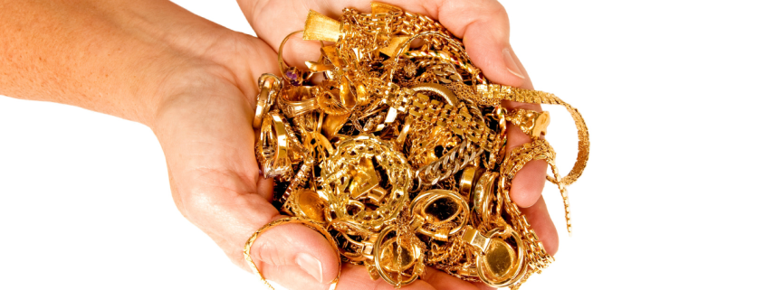 How to Avoid Getting Ripped Off When Selling Your Gold Jewelry - close up of gold jewelry held in two hands close together