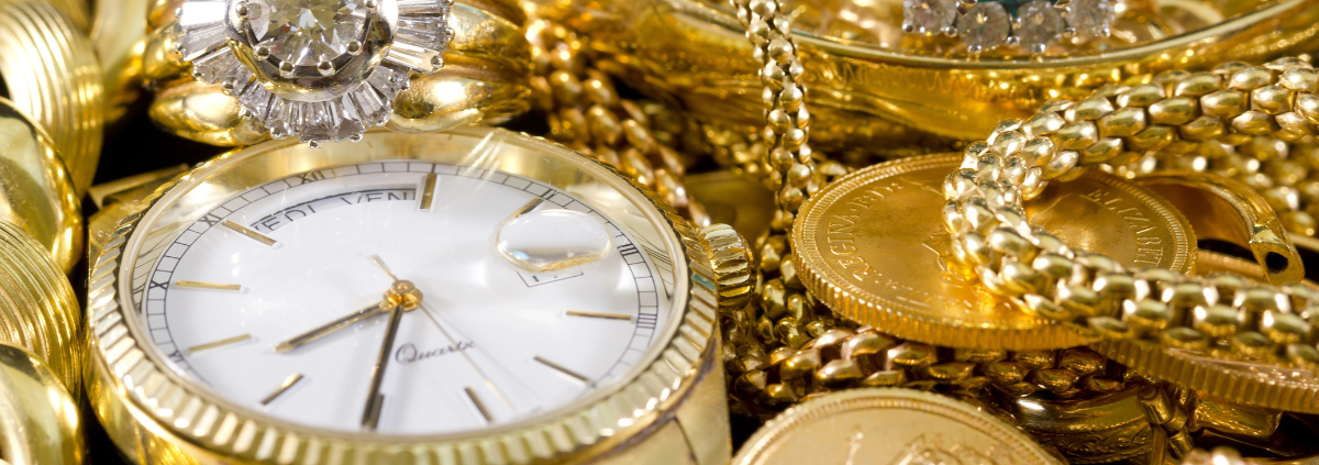 Should I Only Sell My Gold to a Buyer with XRF? - closeup of gold watch, rings, chains, bracelets, and coins