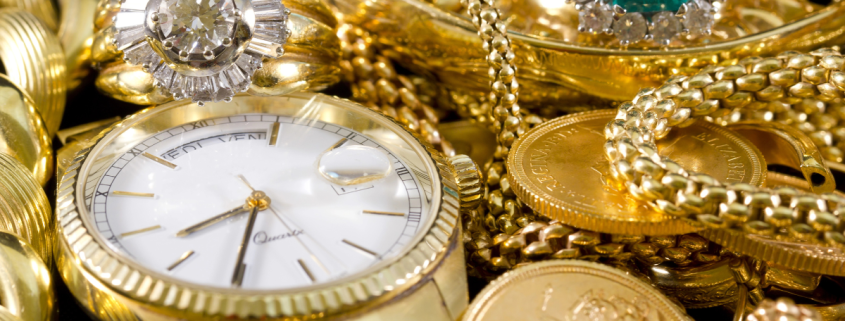 Should I Only Sell My Gold to a Buyer with XRF? - closeup of gold watch, rings, chains, bracelets, and coins