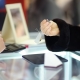 Woman choosing the perfect earrings at a jeweler, close up photo. Focus on your hands.
